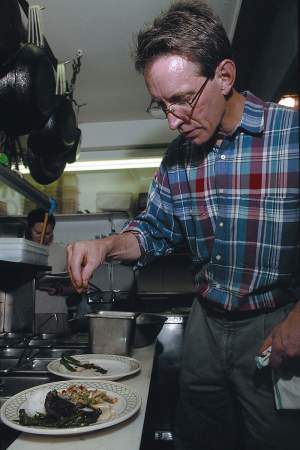 Chef David Hoene prepares his speciality, Fiddlehead Ferns & Brie Balsamico. 