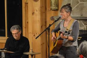Northern Woodlands' board member (and Paul Smith's College professor / Adirondack folk singer) Celia Evans, accompanied by John Foster, kicked off open mic night. 