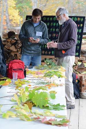 A workshop taught by Jerry Jenkins, whose Northern Forest Atlas photographs appear regularly in the magazine. Here, ecologist Brett Engstrom and another participant discuss materials. 