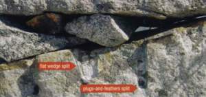 This wall was built circa 1830, when the transition between flat wedge splitting and plug-and-feathers splitting was taking place. The worker alternated a flat slot with a cylindrical hole. According to James Garvin, Architectural Historian for the Sate of New Hampshire, it may be that the mason did not yet have enough plugs and feathers to use only the newer method. 